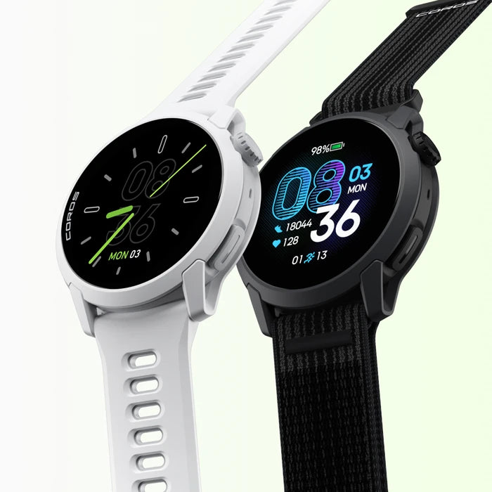 Two smartwatches for running, COROS PACE 4, one white and one black, on a light green background.