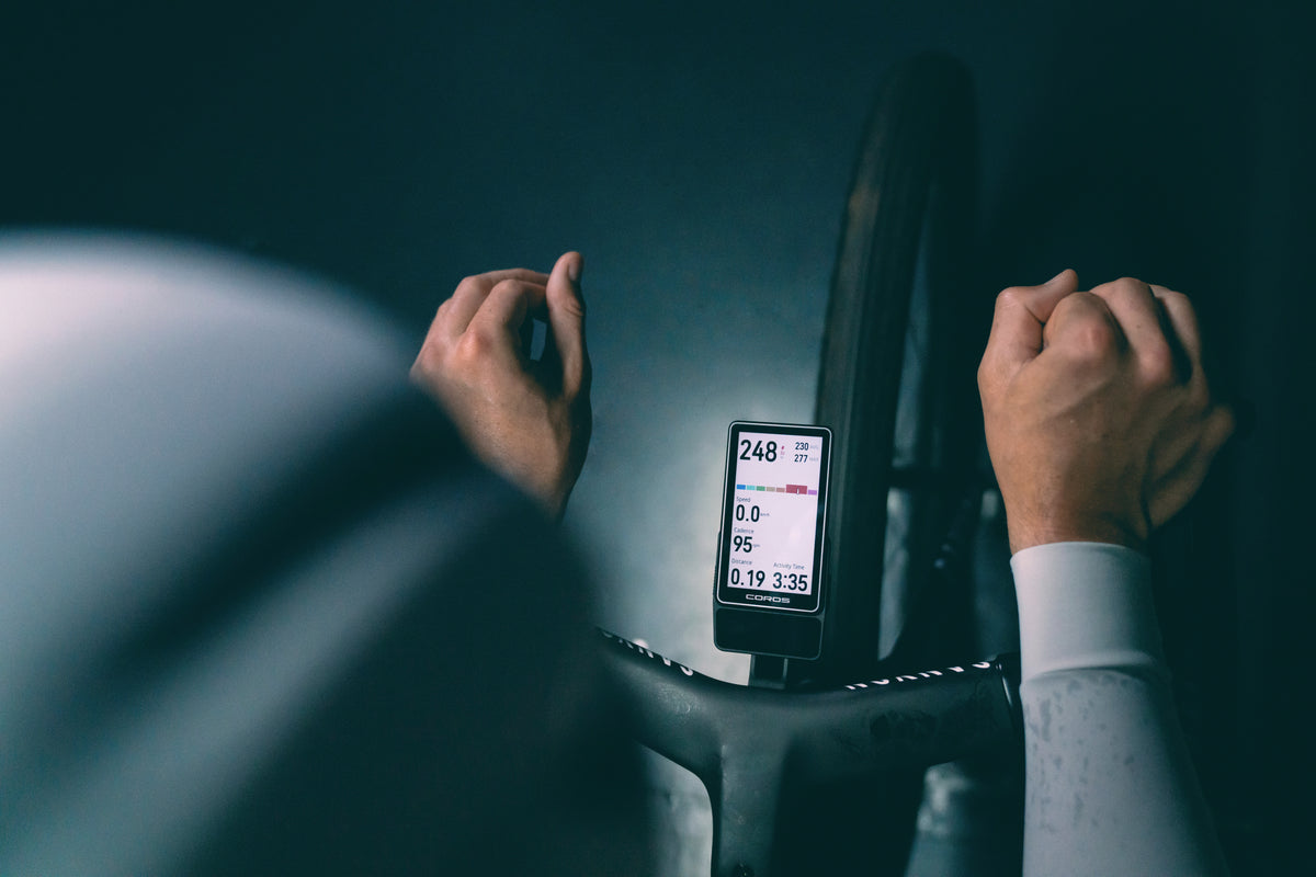 dura2-hero: Rider's hands on the bars with COROS DURA 2 SOLAR